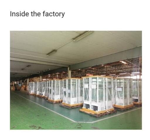 Spacious industrial factory interior with machinery packed for shipping