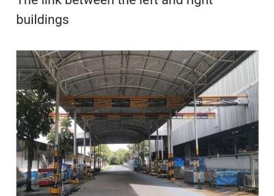 Covered walkway between industrial buildings