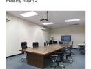 Spacious Meeting Room with Conference Table and Chairs