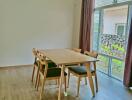 Bright dining area with wooden table and chairs