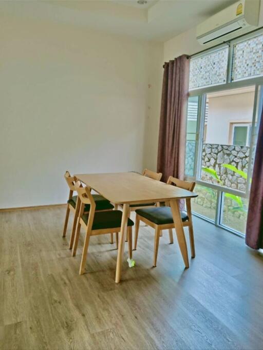 Bright dining area with wooden table and chairs