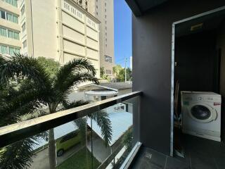 Compact balcony with a view of the street and surrounding buildings