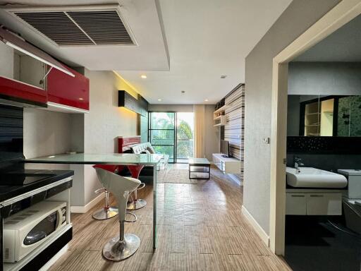 Modern apartment interior with integrated living room and kitchen space