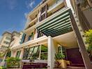 Modern residential building exterior with balconies and clear sky