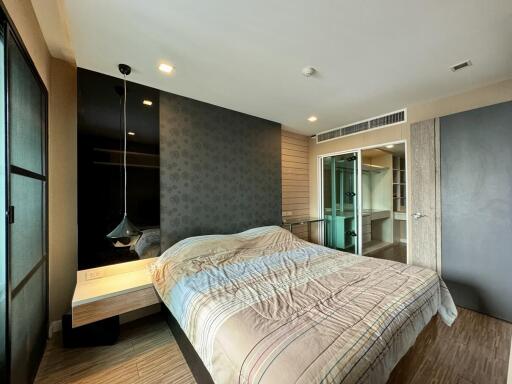 Modern bedroom with a comfortable bed and balcony access