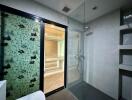 Modern bathroom with walk-in shower and decorative glass partition