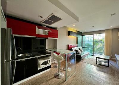 Modern open-plan kitchen and living room with natural light