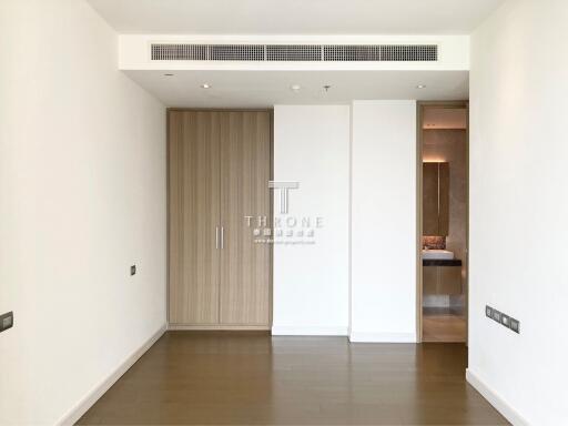 Spacious and modern empty room with wooden door and white walls