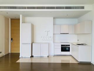 Modern kitchen with white cabinets and built-in appliances