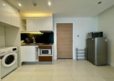 Modern kitchen with appliances and tiled floor