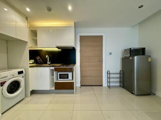 Modern kitchen with appliances and tiled floor