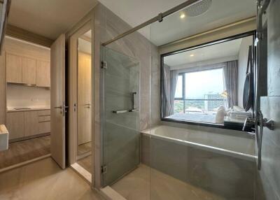 Modern bathroom with neutral tones and city view