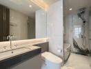 Modern bathroom with marble finishes and gray countertops