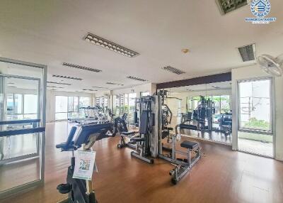 Modern gym facility with exercise equipment and mirrors