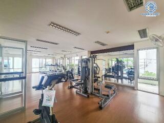 Modern gym facility with exercise equipment and mirrors