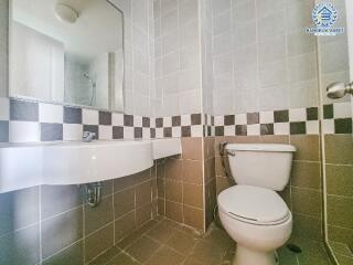 Compact bathroom with checkered tile design