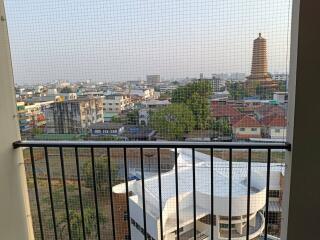City view from high-rise balcony with safety railing
