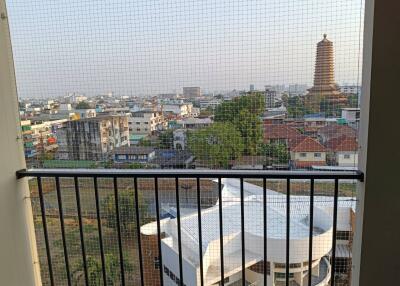 City view from high-rise balcony with safety railing