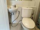Compact bathroom with white fixtures