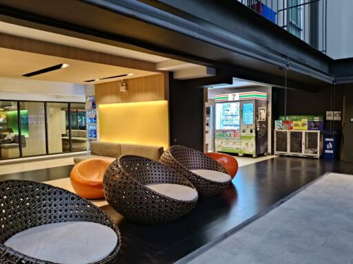 Modern lobby area with comfortable seating and vending machines