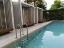 Residential pool area with surrounding decking and privacy fencing