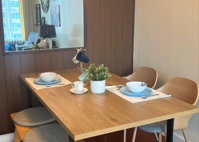 Modern dining area with wooden table and stylish chairs