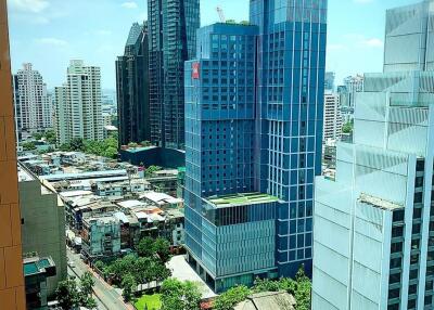 Cityscape view from a high-rise building showing urban architecture and skyline