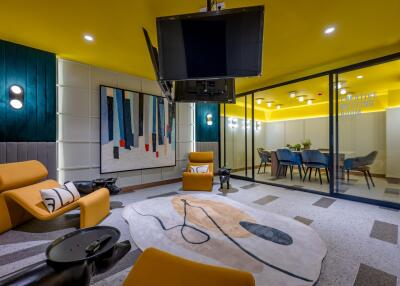 Modern living room with bright yellow walls and contemporary furniture