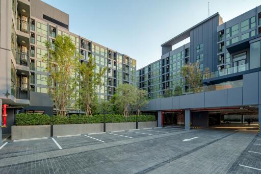 Modern apartment complex with parking area