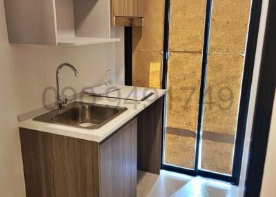 Modern kitchen with wooden cabinets and natural light