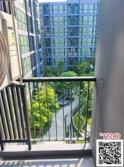 View from balcony overlooking inner courtyard with lush greenery