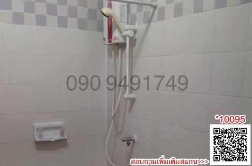 Modern bathroom interior with wall-mounted shower head