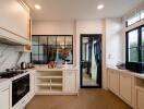 Modern kitchen with stainless steel appliances and white cabinetry