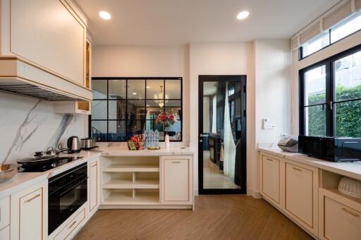 Modern kitchen with stainless steel appliances and white cabinetry