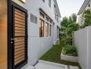 Exterior view of a modern house with side garden