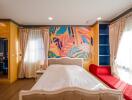 Bright and colorful bedroom with artistic wall design and modern furniture