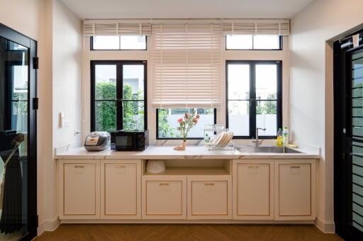 Modern kitchen with large windows and clean design