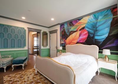 Spacious Bedroom with Colorful Wall Art and Elegant Furniture