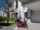 Modern home exterior with a parked scooter