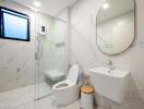 Modern bathroom with glass shower and marble finish