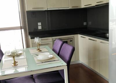 Modern kitchen with dining area and large windows