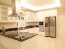 Modern kitchen with white cabinets and stainless steel appliances