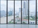 Spacious room with a panoramic view of the city skyline and river