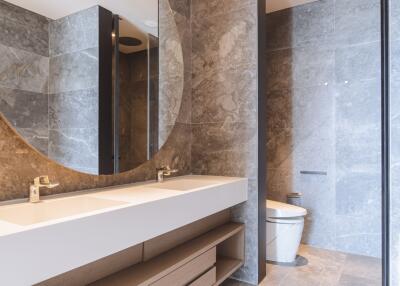 Modern bathroom with marble tiles and sleek fixtures