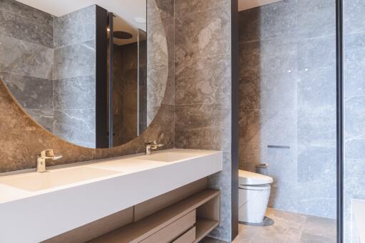 Modern bathroom with marble tiles and sleek fixtures