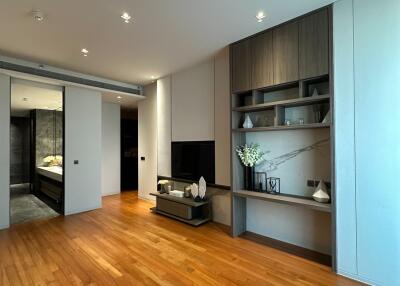 Modern living room with wooden flooring and built-in shelves