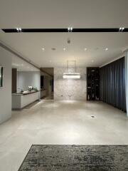 Contemporary building entrance with elegant lighting and marble wall design