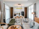 Modern living room seamlessly connected to a well-equipped open kitchen