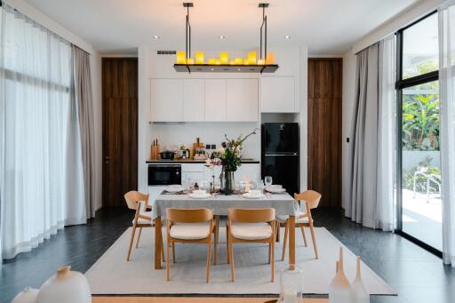 Modern kitchen and dining space with elegant design and natural lighting