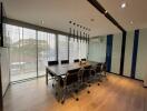 Spacious modern office with large table, chairs and ample natural light